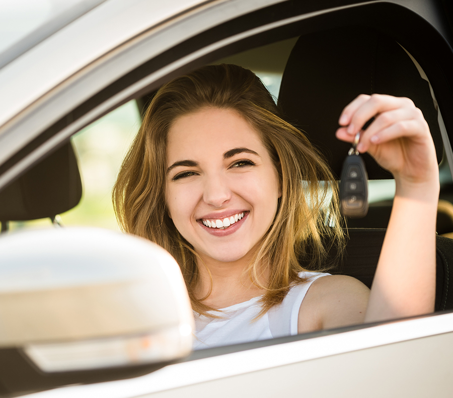 Happy woman holding car keys