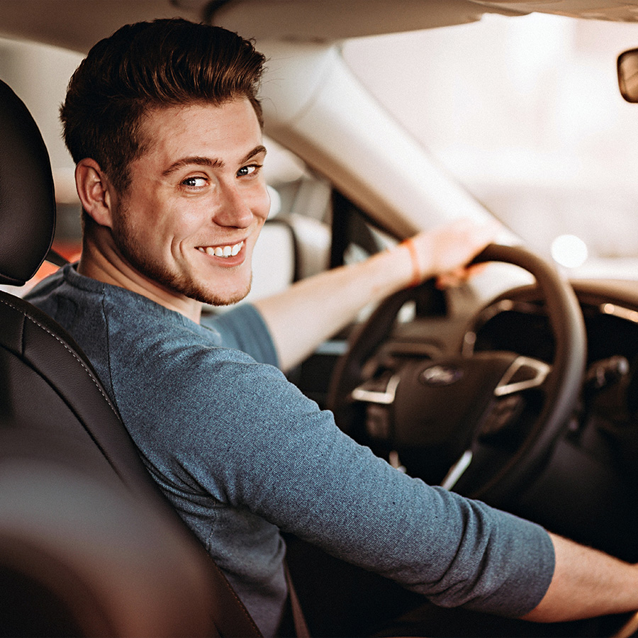 young adult buying a new car