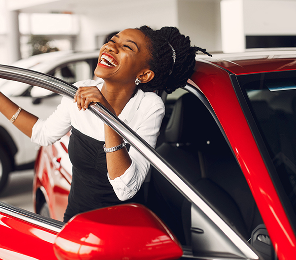 Happy customer emerging from car