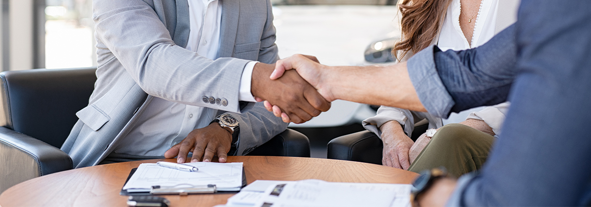 customer shaking hands with employee