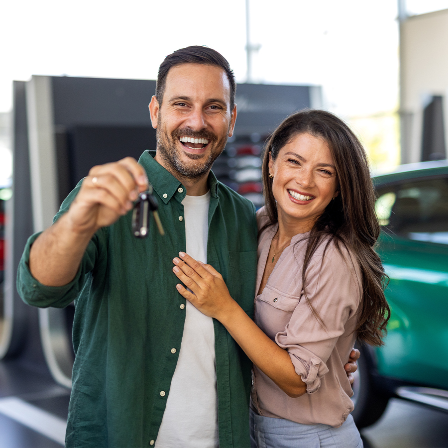 happy couple with keys