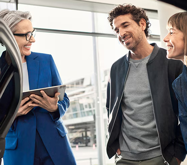 couple talking in dealership