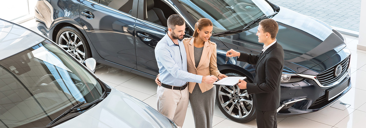 Customers at car dealership