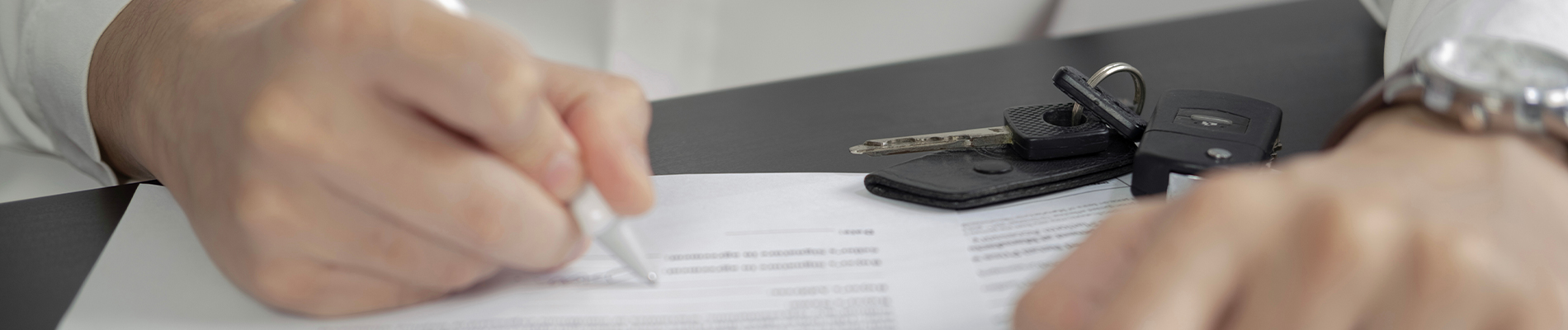 signing contract for new car purchase