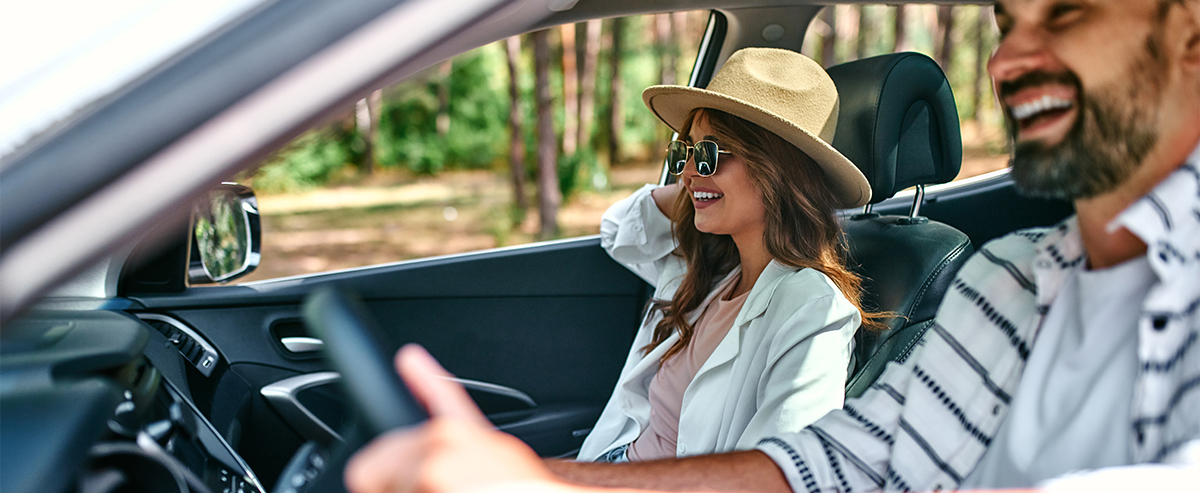 smiling customer in their car