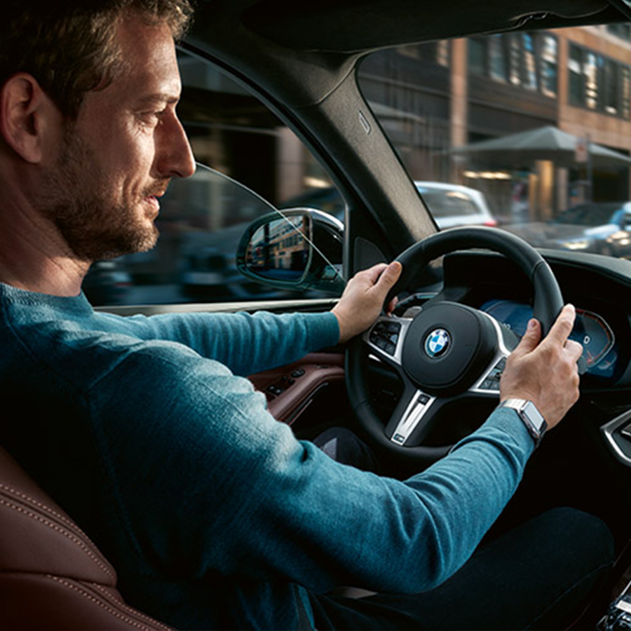 man driving BMW