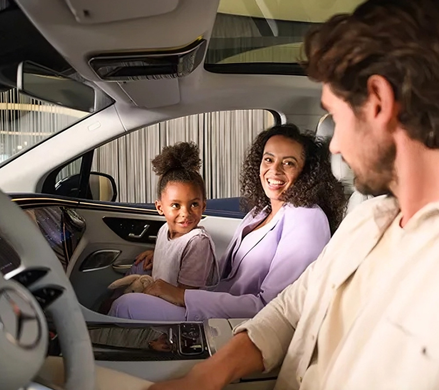 Happy customers in their Mercedes-Benz vehicle