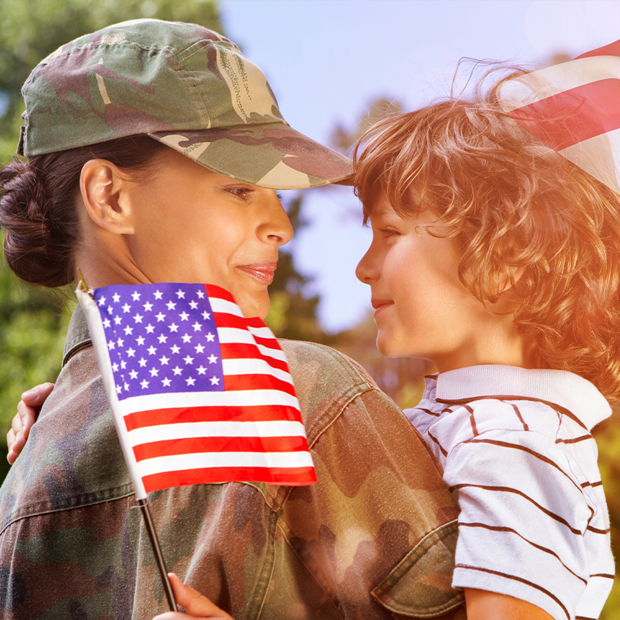 Soldier holding child
