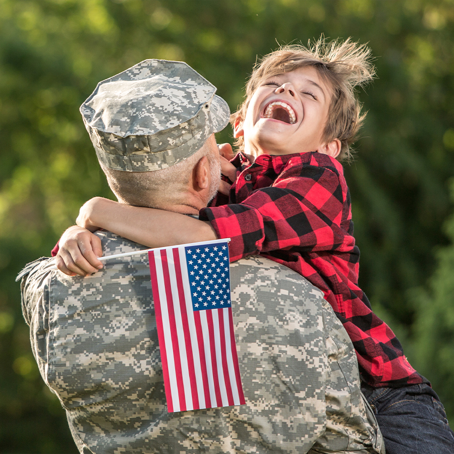 Veteran holding his son