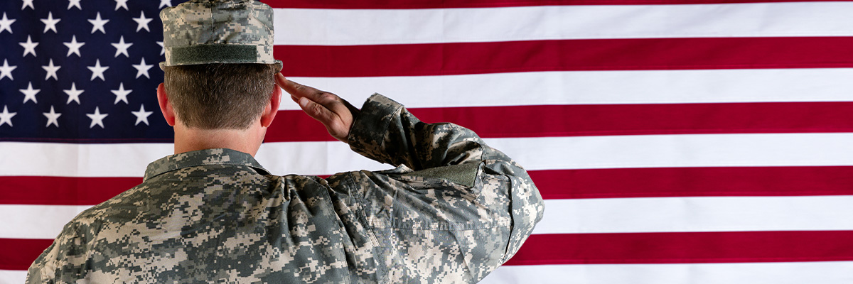 Soldier saluting the American flag