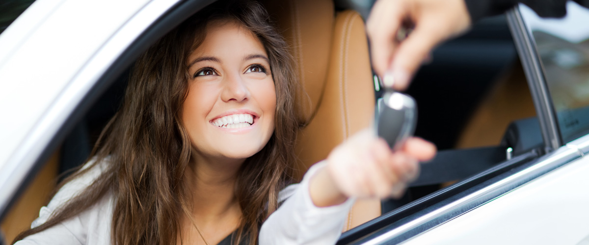 smiling customer in their car