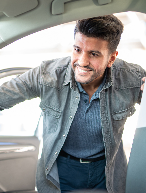 customer looking inside of a car