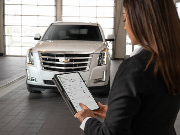 Close up of a person holding keys over a customers hand