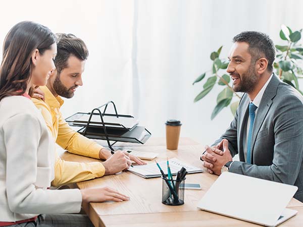Dealership employee speaking with a customer about their finance options