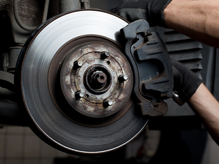 Close up of hands holding brake pads