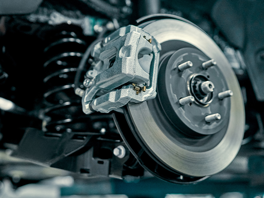 Close up of hands holding brake pads