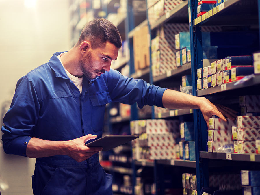 Service tech checking inventory for parts