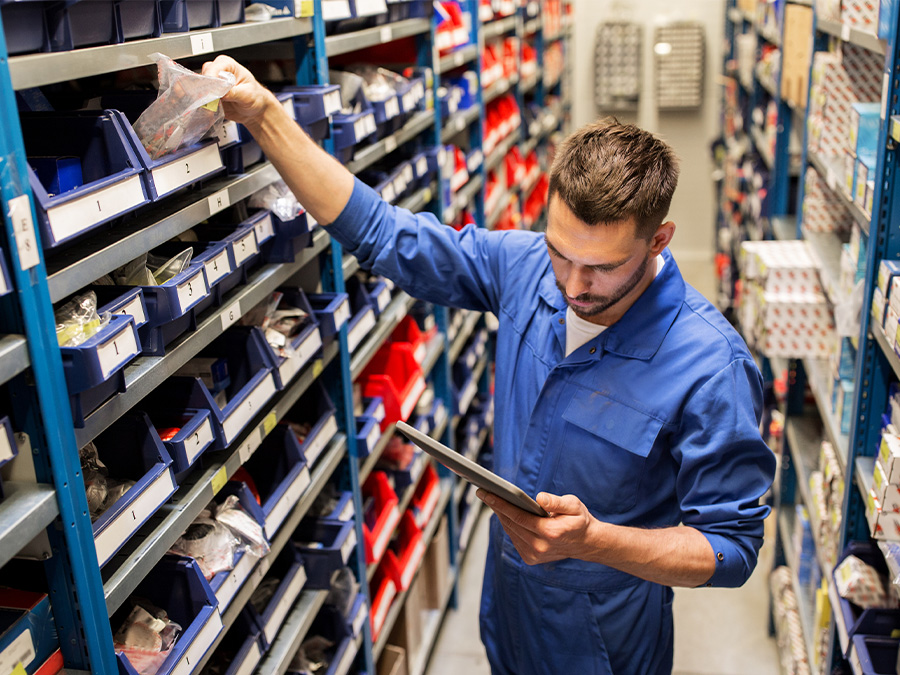Service tech checking inventory for parts