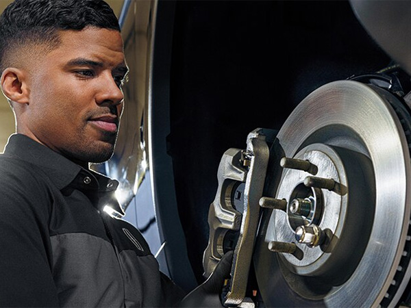 Close up of hands holding brake pads