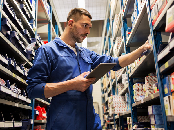 Service tech checking inventory for parts