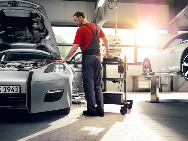 Service tech testing a battery