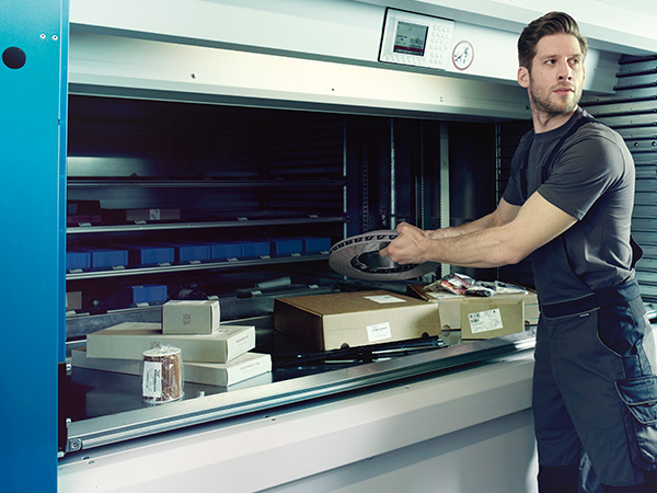 Service tech checking inventory for parts