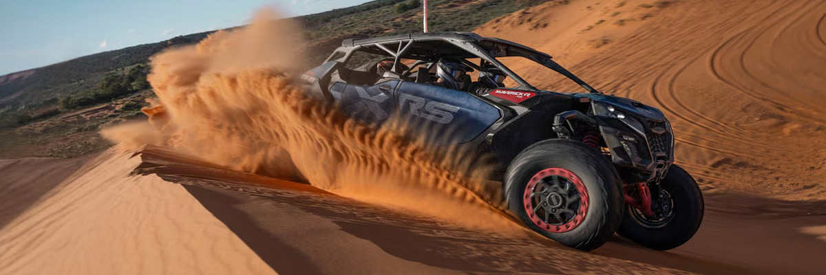 Can-am Maverick R Max X RS speeding through the sand dunes