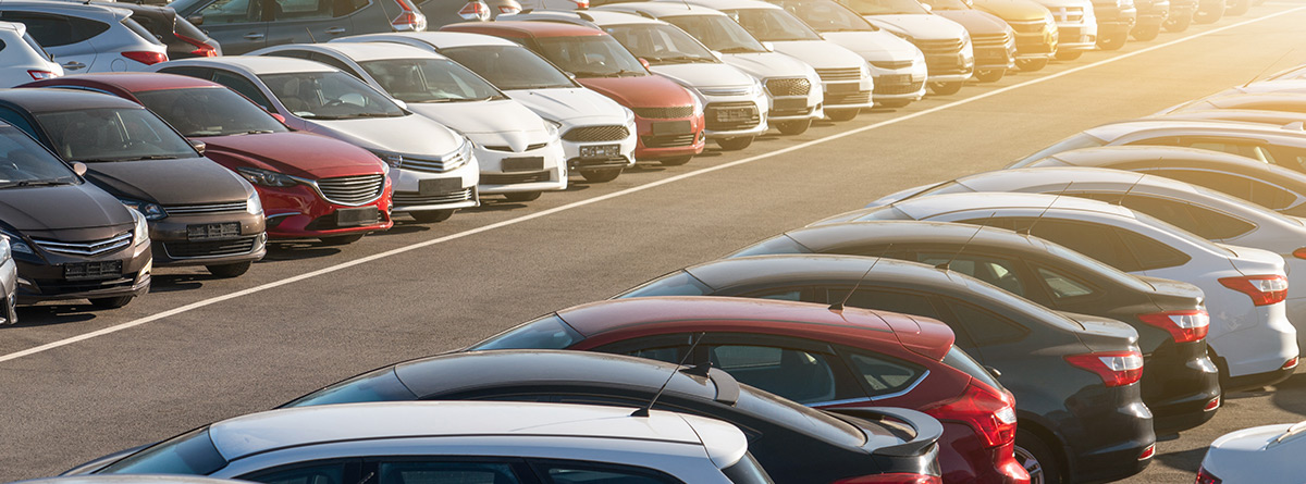 Cars in dealership parking lot