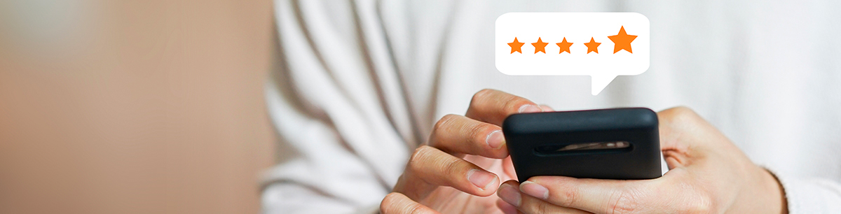 Customer leaving 5 star review on smartphone