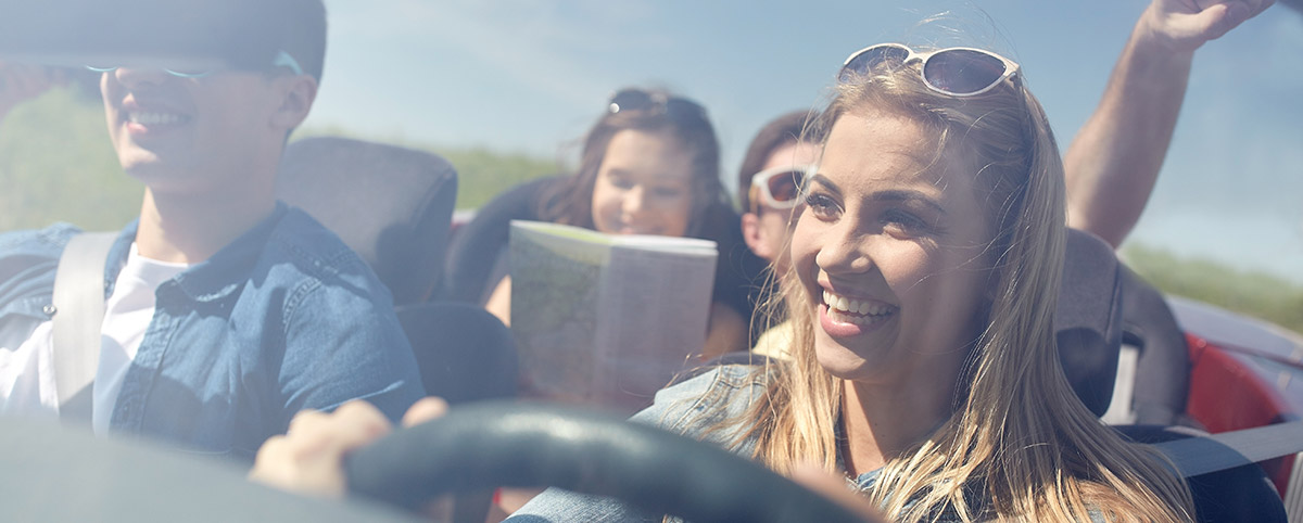happy young people shown driving