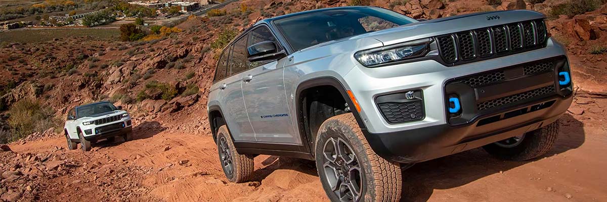2023 Jeep Grand Cherokees driving through rough terrain