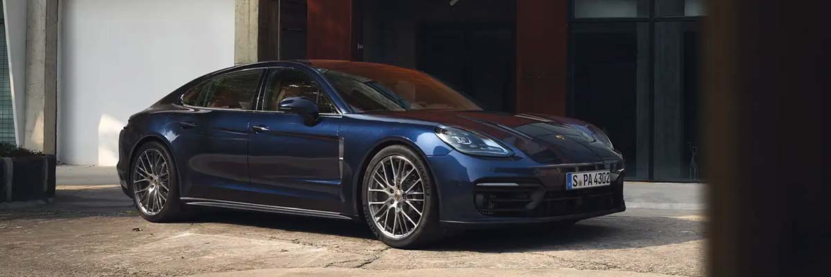 Porsche Panamera parked outside of an office building