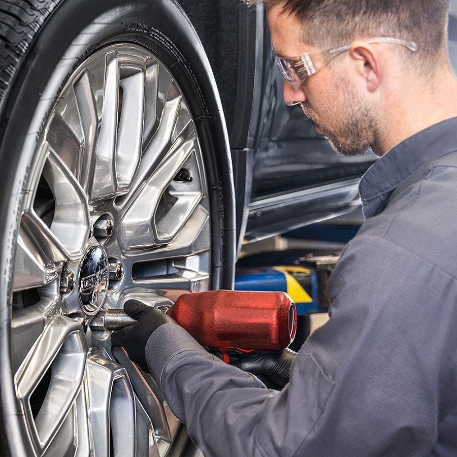 Service tech working on tire