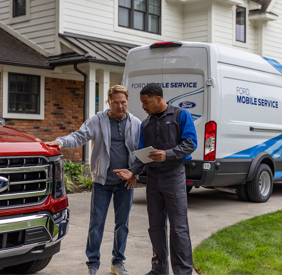 Ford Mobile Service van with technician talking to customer.