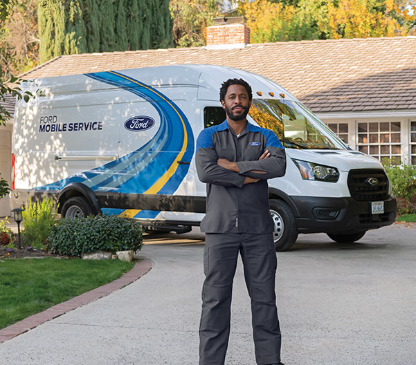 Mechanic standing infront of Ford Mobile Service Van