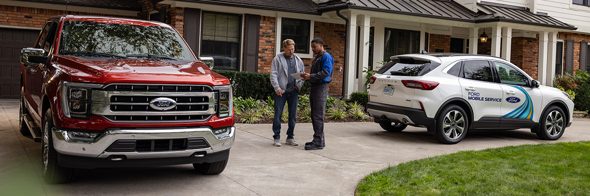 Ford Mobile Service tech talking with customer