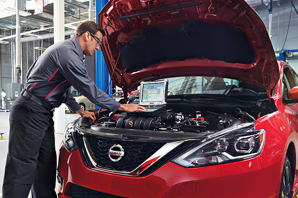 Repairman buffing out car