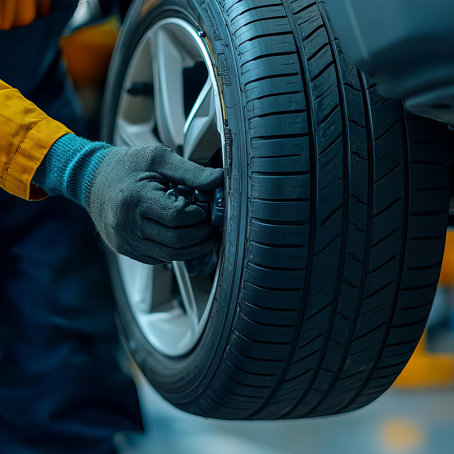 Mechanic Performing Tire Rotation and Balancing – Professional Auto Maintenance for Safety and Performance