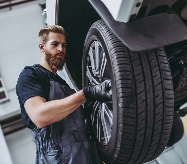 man servicing tires