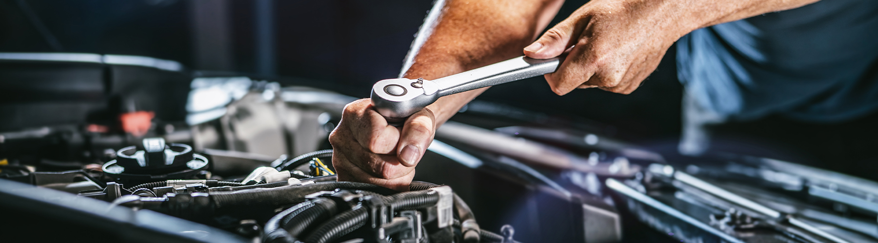 Service tech working on a car