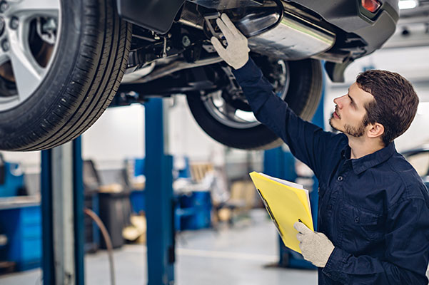 Technician checking a car