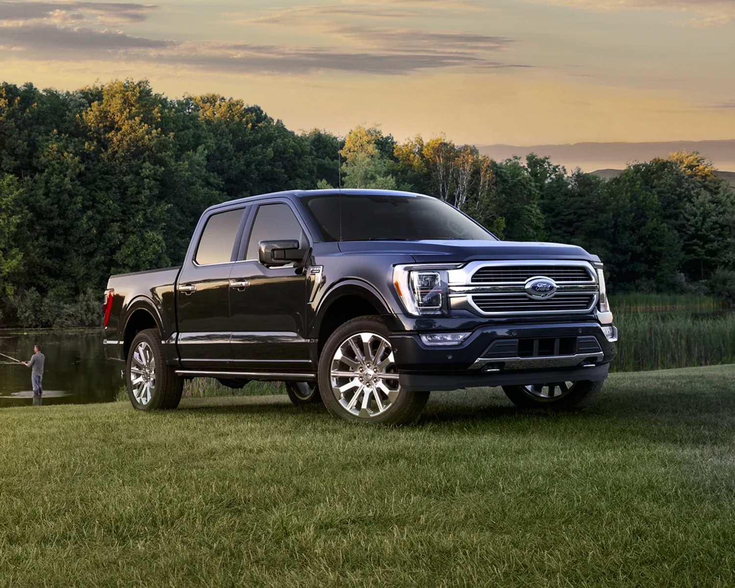 Ford F-150 parked next to a pond where a man is fishing