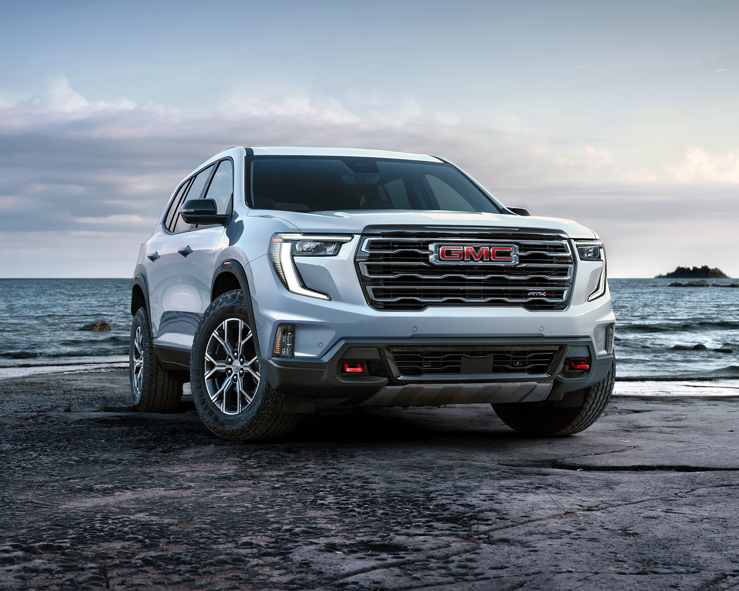 2024 GMC Acadia parked next to the water