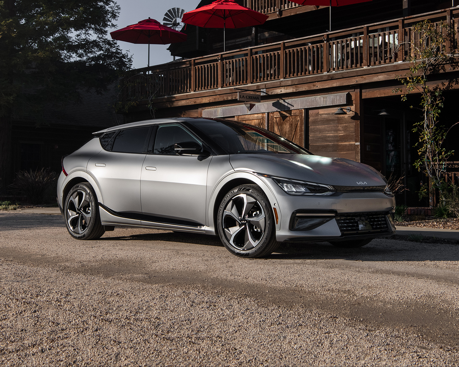 2025 Kia EV6 parked in front of a cabin