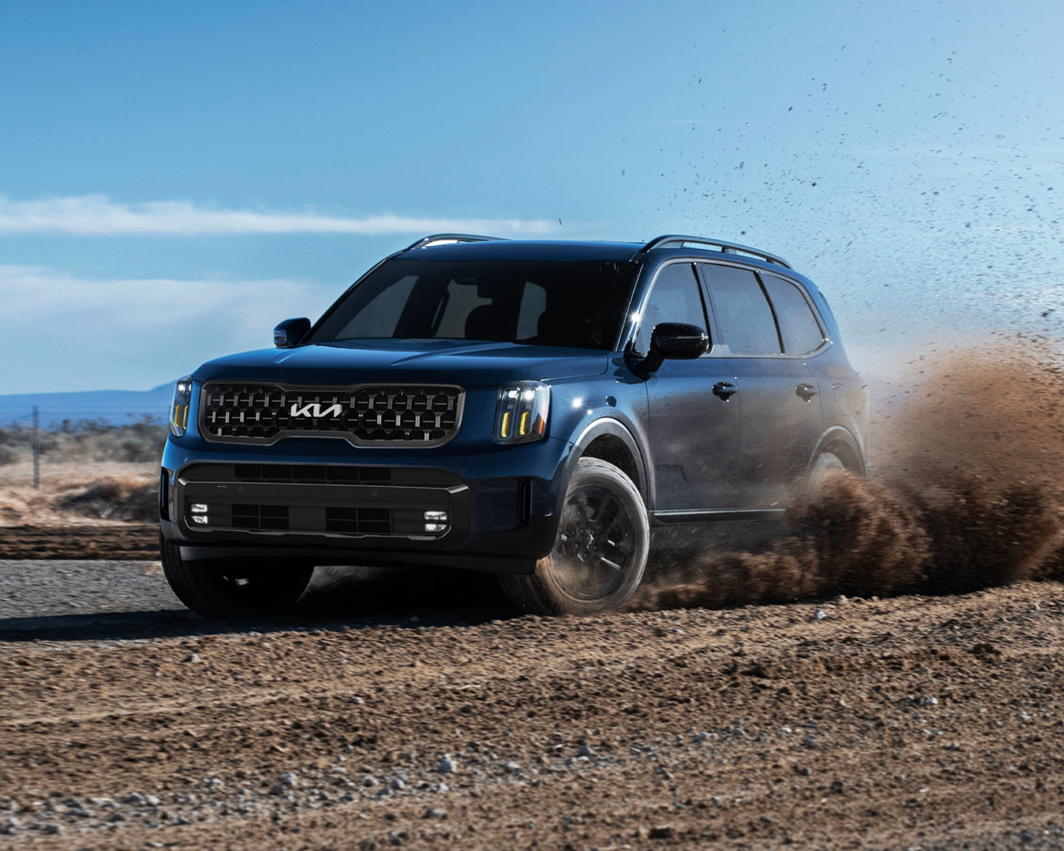 2025 Kia Telluride driving on a dirt area