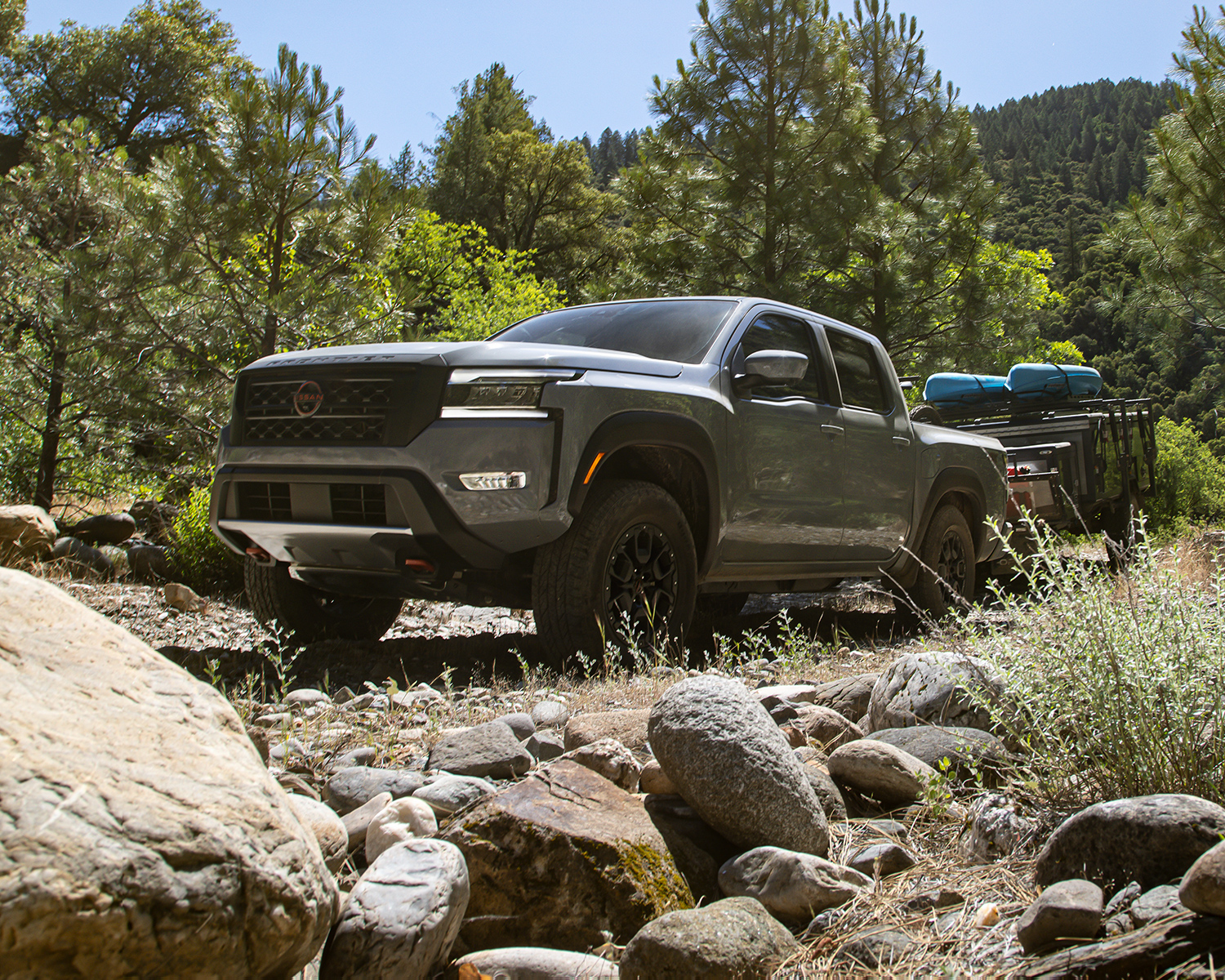 2024 Frontier parked in the woods surrounded by trees