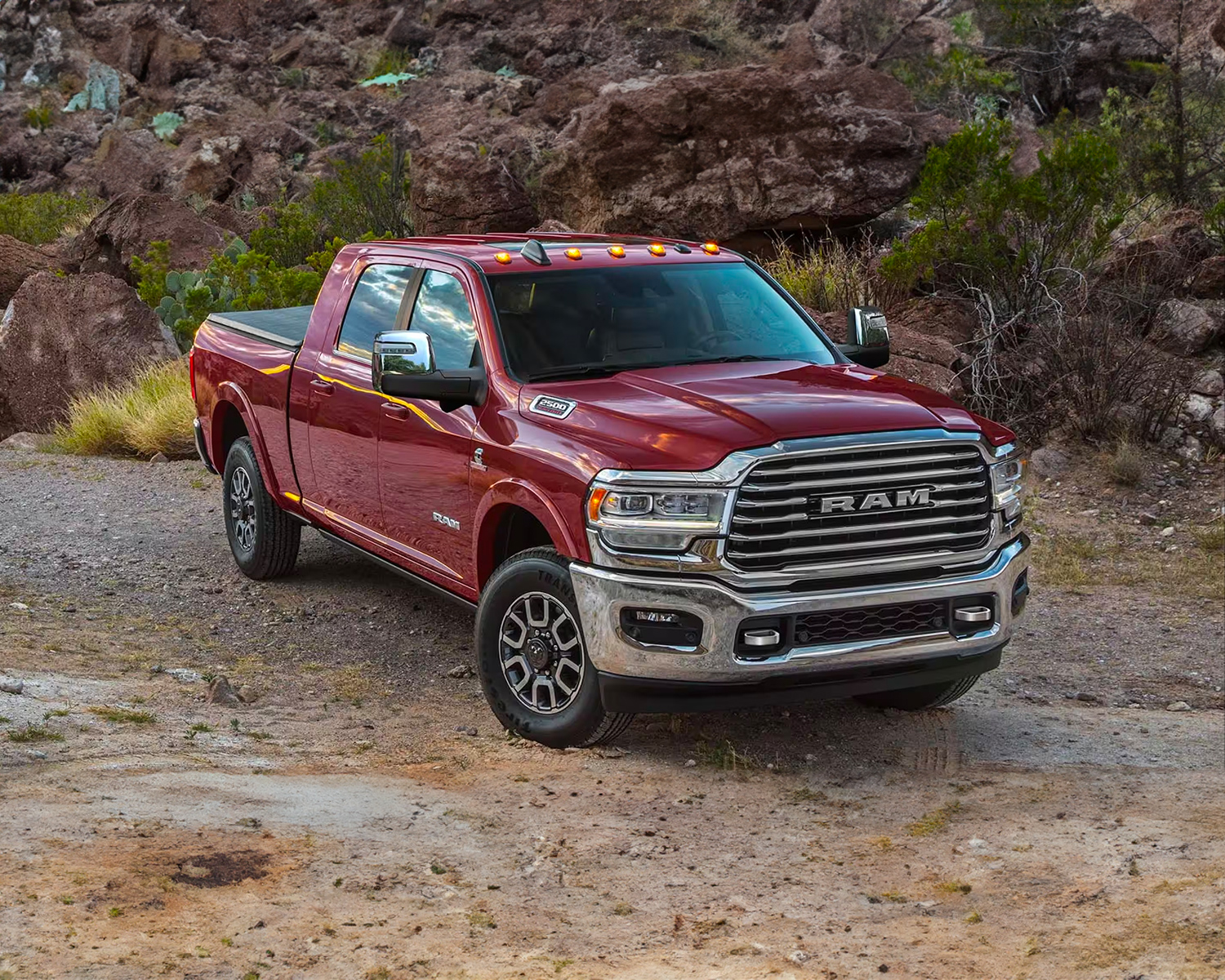 A Ram 2500 parked off road on a rocky terrain