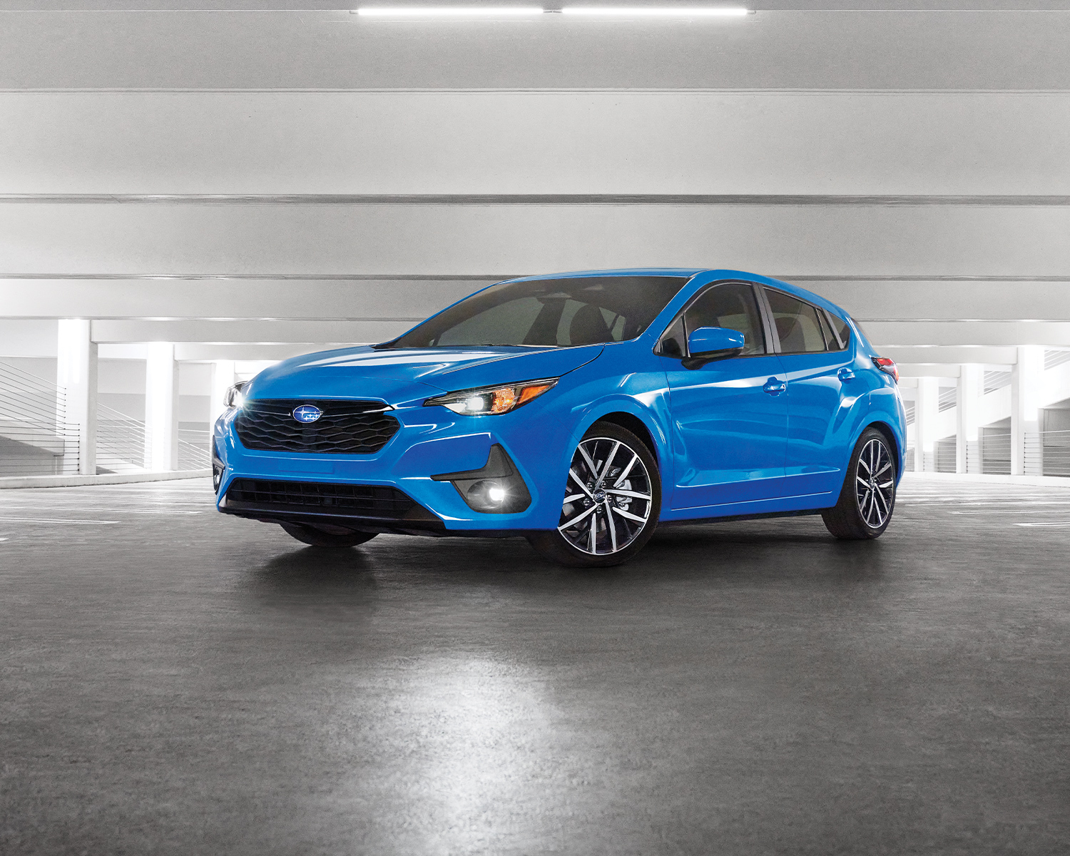 blue Impreza in a parking garage