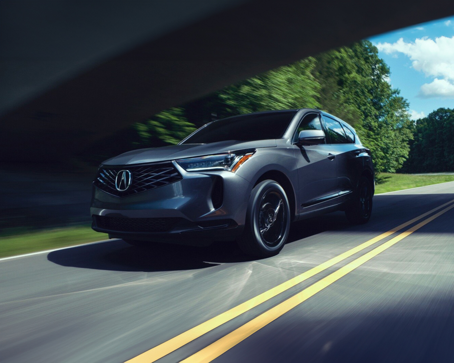2025 Acura RDX driving under overpass