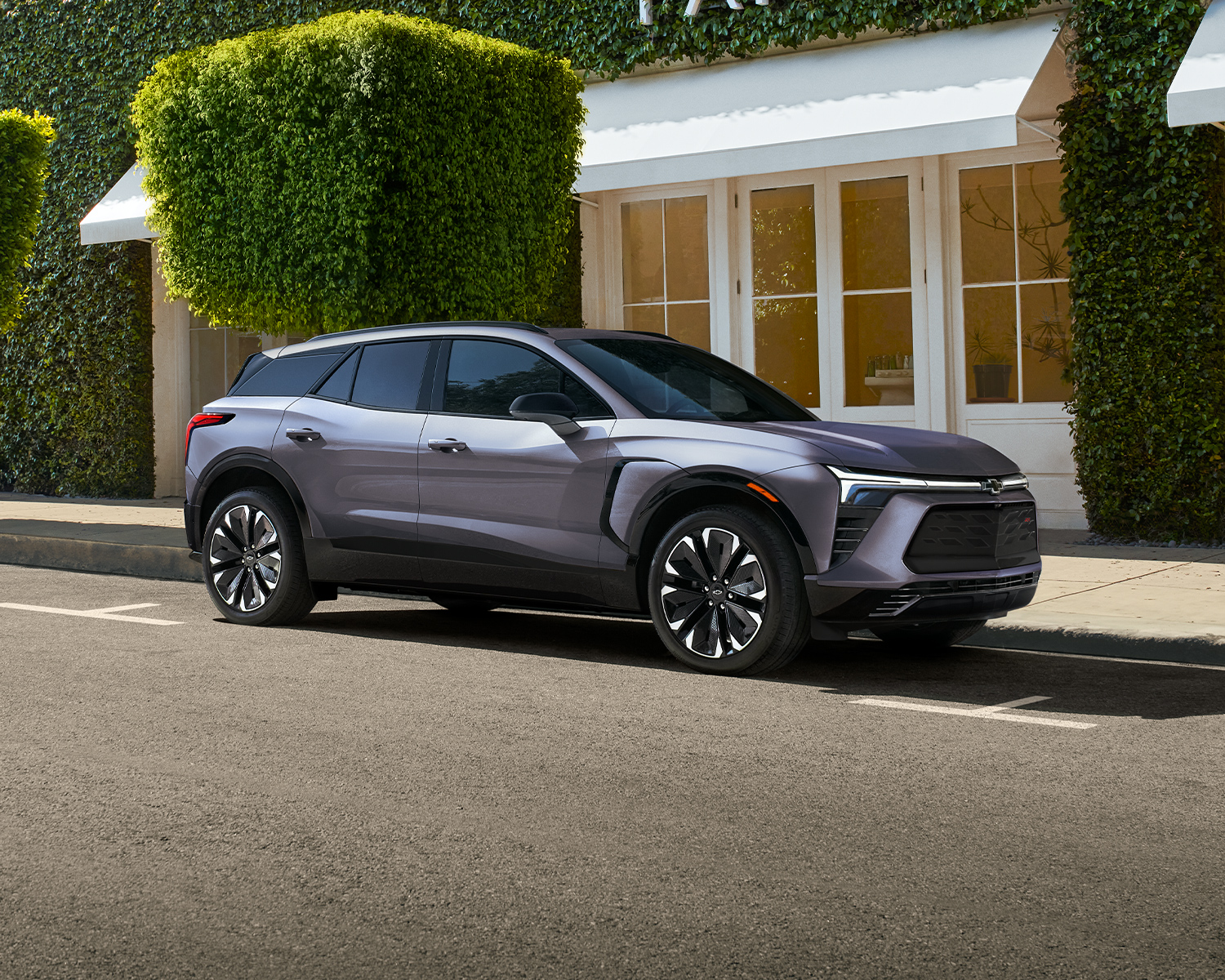 2025 Blazer EV parked in front of a small business